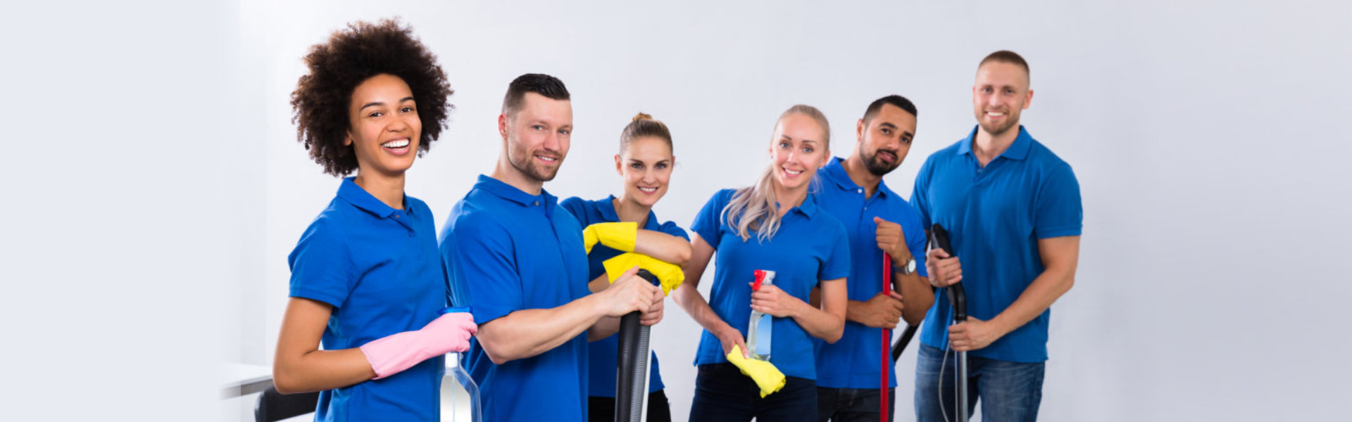 A group of individuals in blue shirts