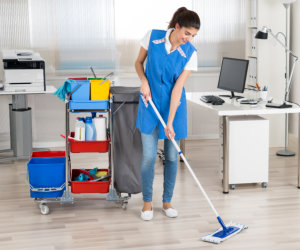 Person vacuuming the carpet