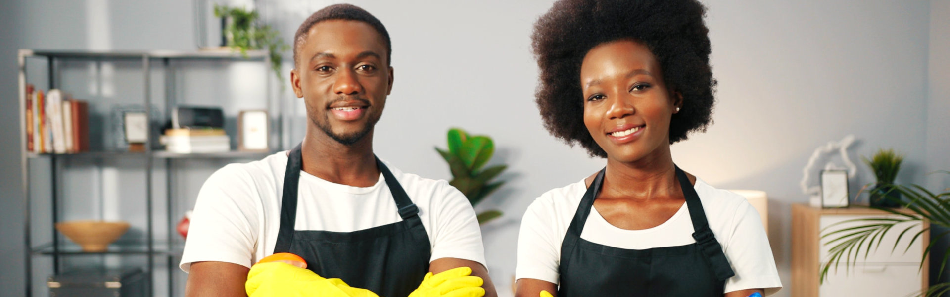 Two people wearing aprons