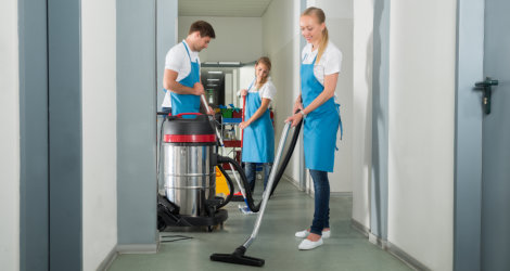 People cleaning the carpet